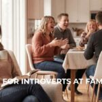 Introvert woman reading a book and drinking tea in a quiet corner, managing her energy while a loud family party continues in the background.
